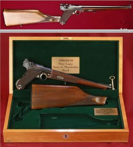 This is a excellent example of the 1920 Model DWM (Deutsches Waffen Und Munitionsfabriken Co) sporting carbine. These were a limited manufacture for the "light rifle market". The barrel is 300mm long with a ramp front sight and "Navy" rear site in the 9mm. These guns utilized the "short" frame and sear of the later models along with the characteristic diced toggles. In addition to the long Mannlicher stock there is the ('06) grip safety (2nd Issue Navy) and (08') model sear and toggles, manufactured after the 1st World War for the commercial market inside Germany. Truly a custom Das Gewehr des Jägers.